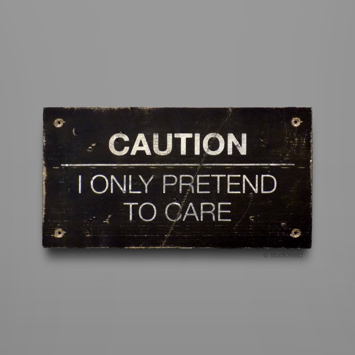 I only pretend to care - Sign